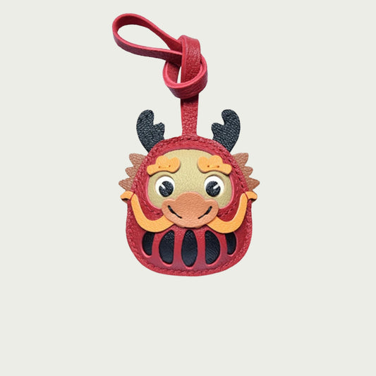 Porte-clés Daruma moustachu, symbole de chance et de prospérité.